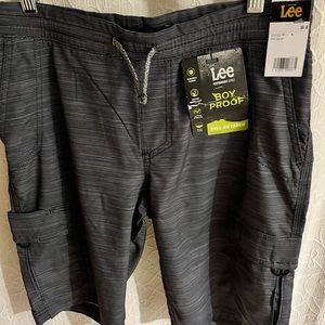Heathered black/gray draw string shorts by Lee. Stretchy, water repellant fabric